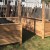 A raised bed made of wood on a lawn.