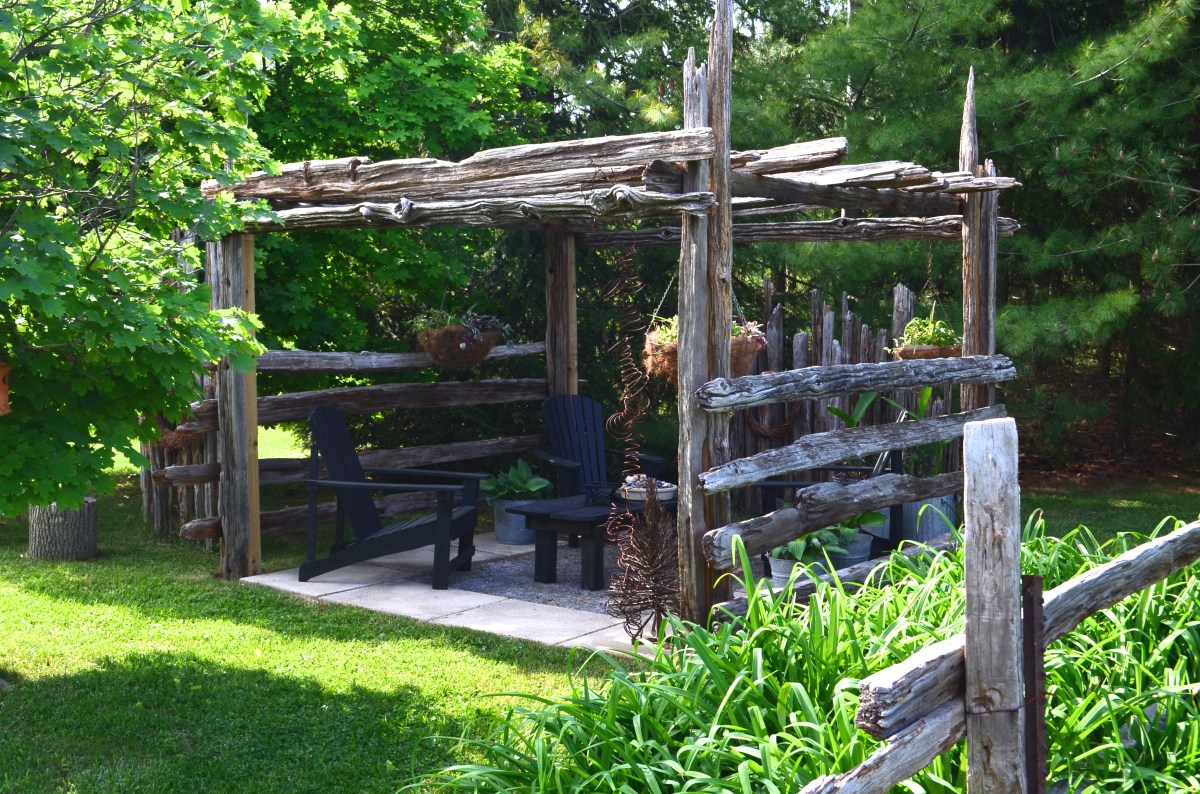 A wooden pergola provides shady seating.