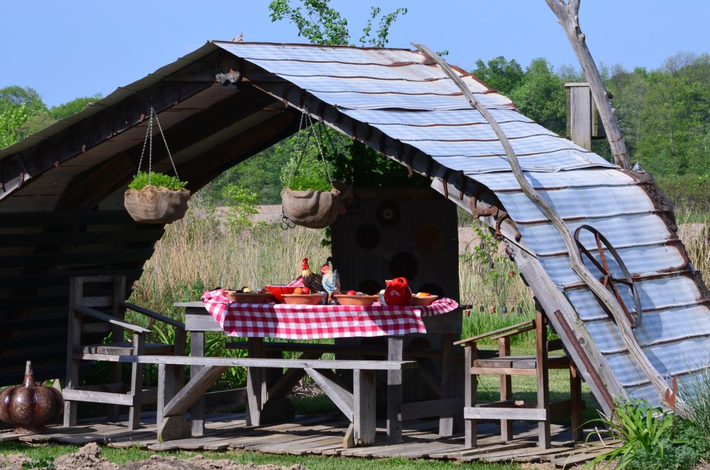 An outdoor seating area with a farm theme.