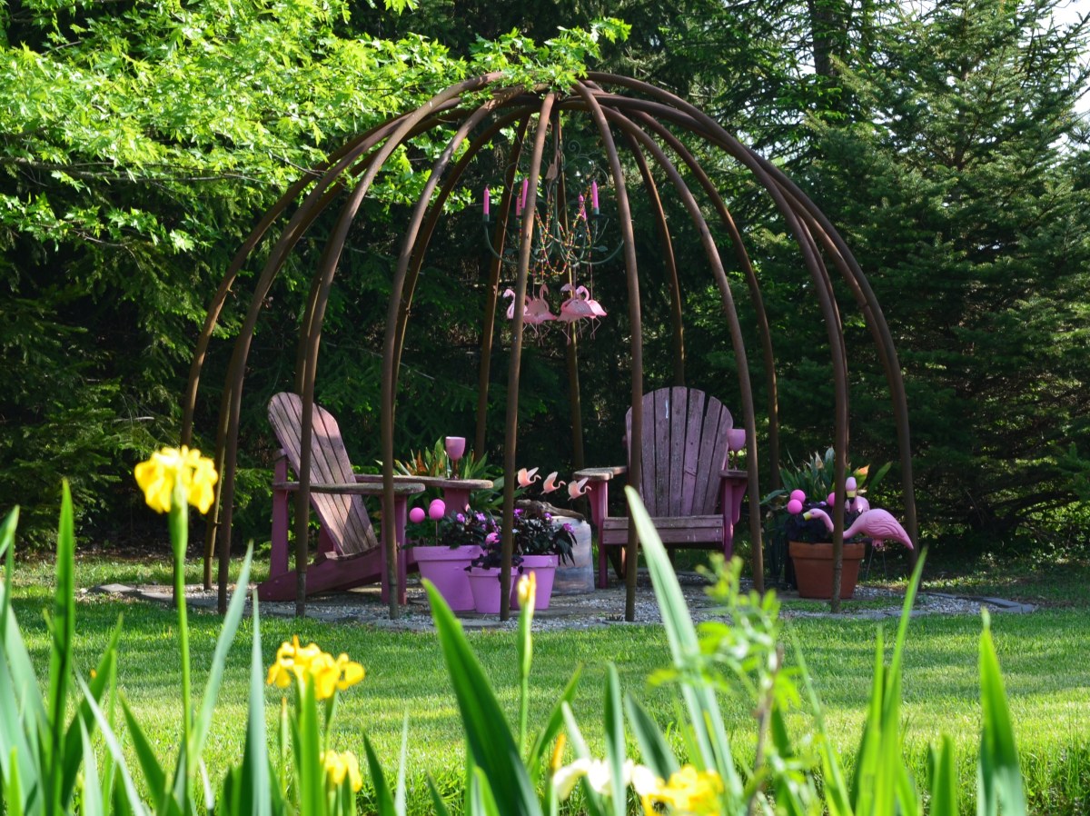 A garden seating area with a pink theme.