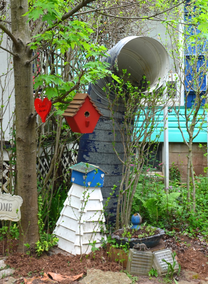 A ship's funnel is used as a garden decoration.