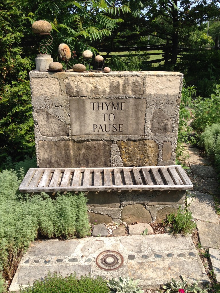 A garden wall looks like sculpture and provides garden seating.