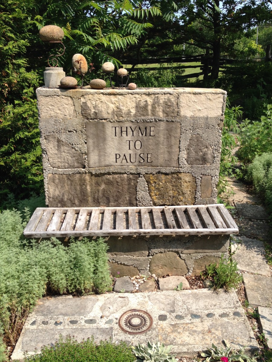A garden wall looks like sculpture and provides garden seating.