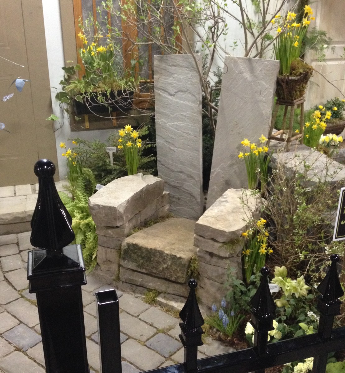 A large garden chair is made of stone.