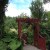 An ornamental gate leads into a lush garden at Lost Horizons