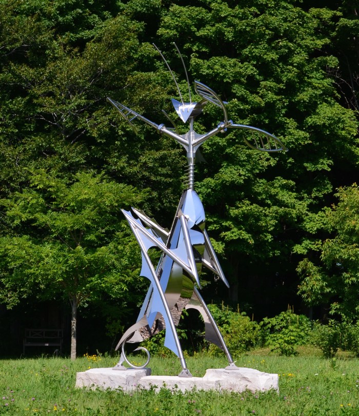 A large praying mantis garden sculpture