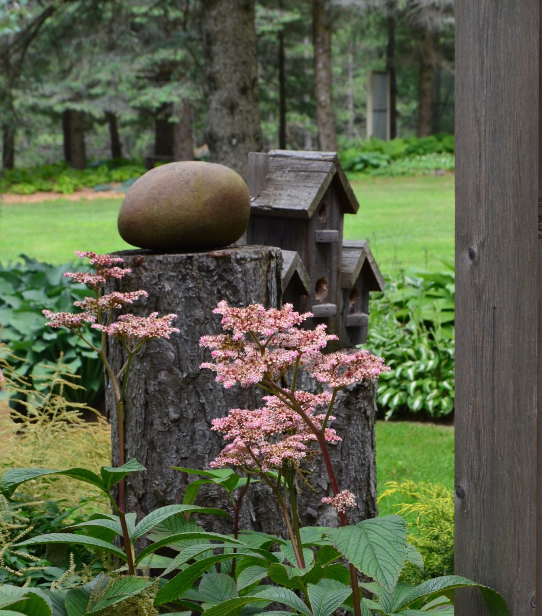 Simple garden decor makes a big statement in this woodland garden.