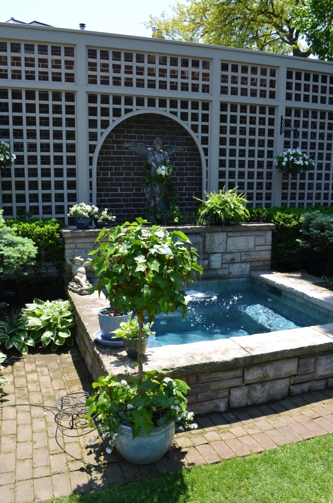 A hot tub acting as a garden focal point.
