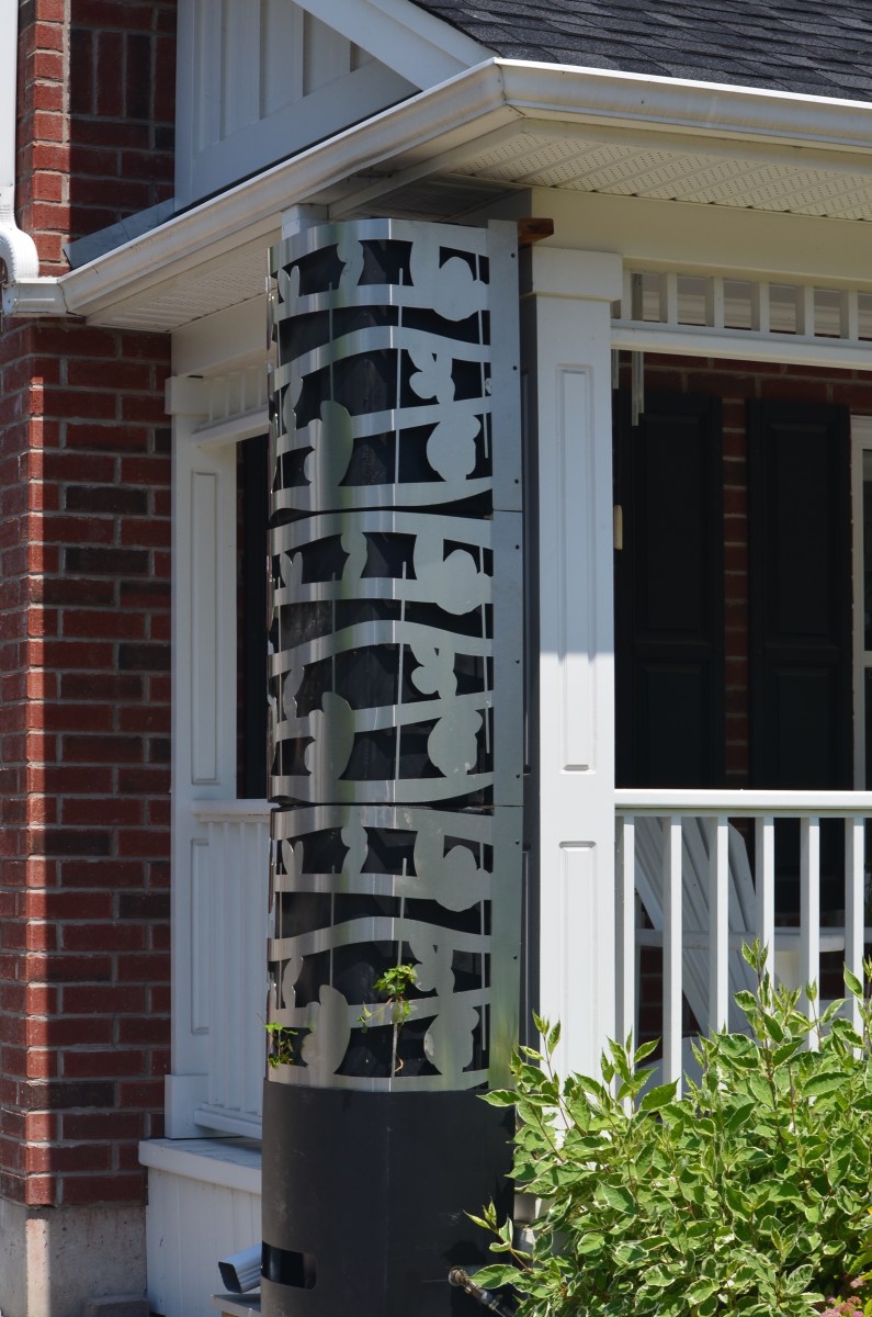 A close up of a custom made rain barrel.