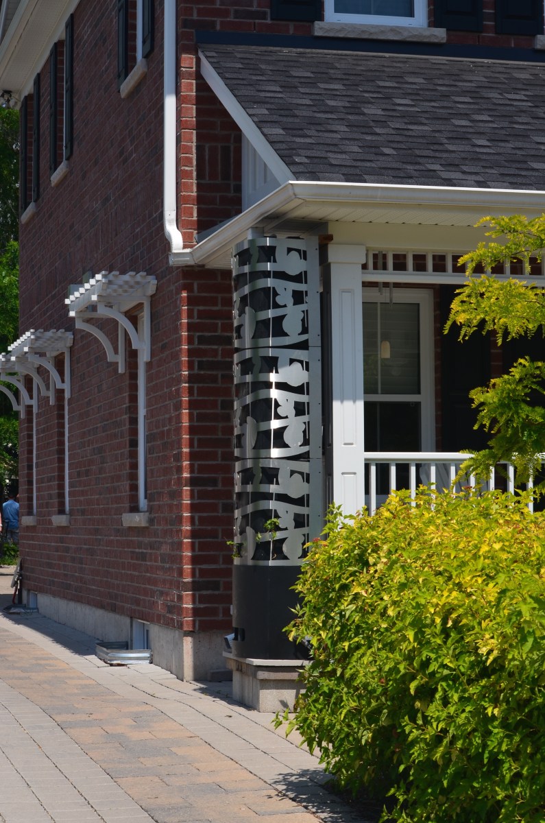 A rain spout and barrel becomes a focal point.