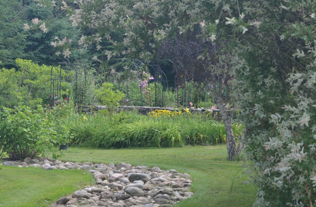 A walled garden becomes a garden focal point with a collection of plant supports.