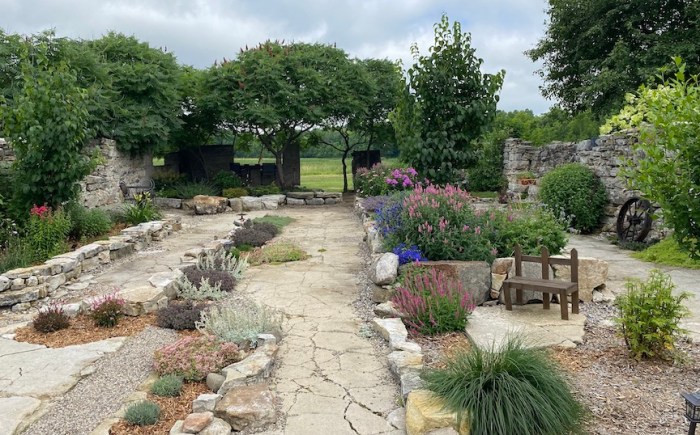 Full length view of barn garden
